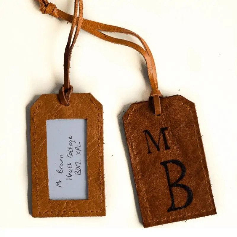 DIY Gifts For Long-Distance Boyfriend: Leather Luggage Tags via Vicky Myers Creations
