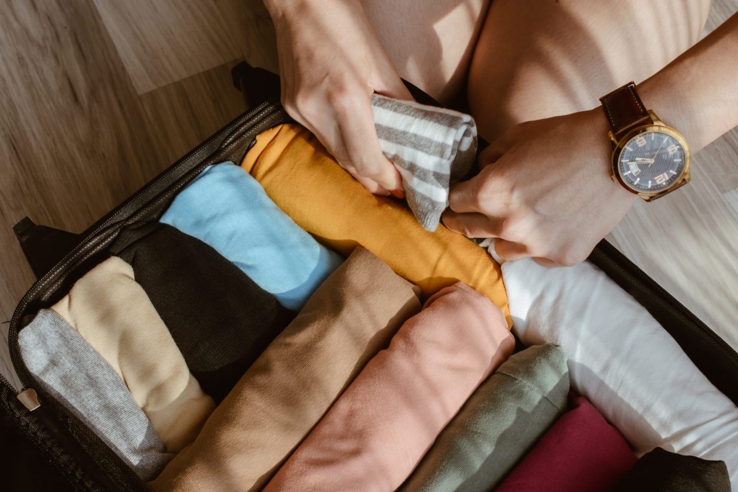 suitcase packing tips: roll your clothes