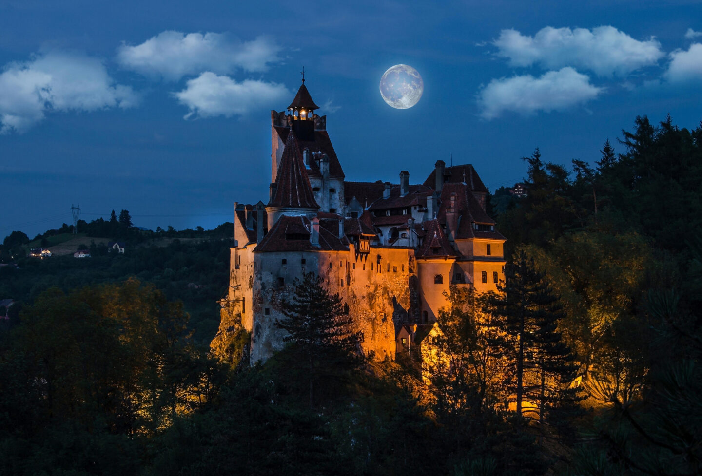 Bran Castle - Dracula's medieval castle - at night with full moon, Transylvania. Romania