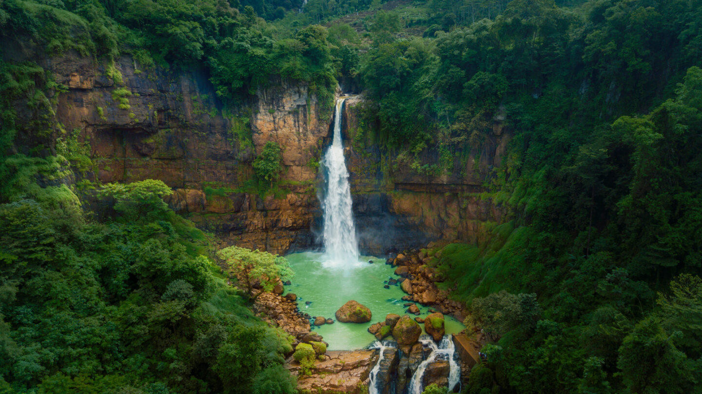 Beautiful scenery of Gitgit waterfall hidden in the tropical forest. Shot in Bali, Indonesia