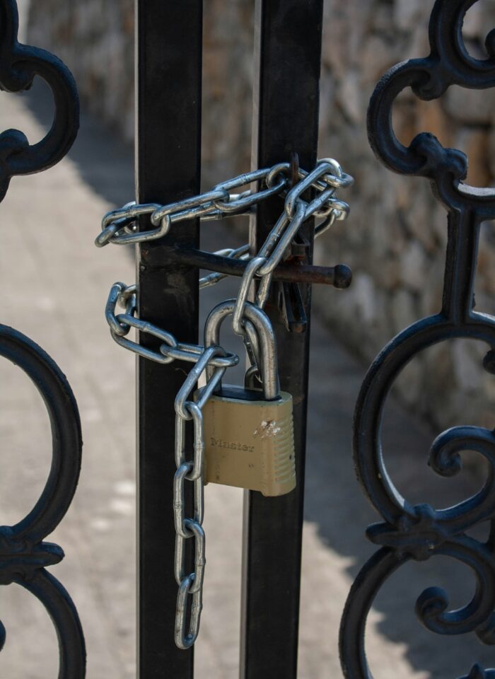 gate locked with a chain and padlock