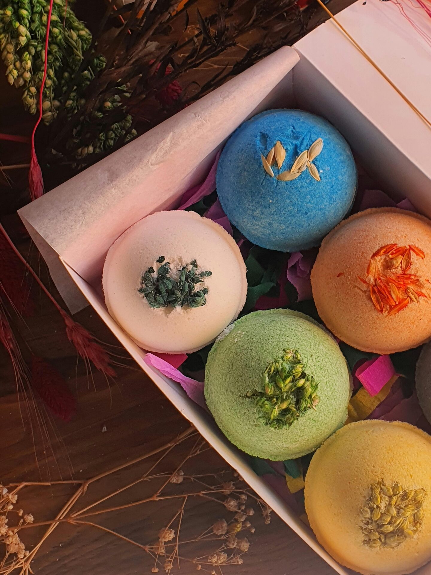 Colorful handmade bath bombs in a gift box – a relaxing and fun gift for teen girls.