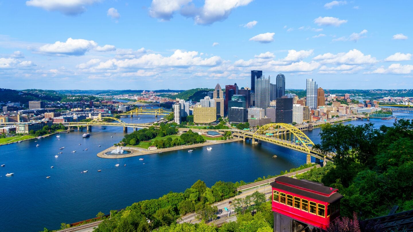 Aerial view of Pittsburgh skyline and rivers during summer weather