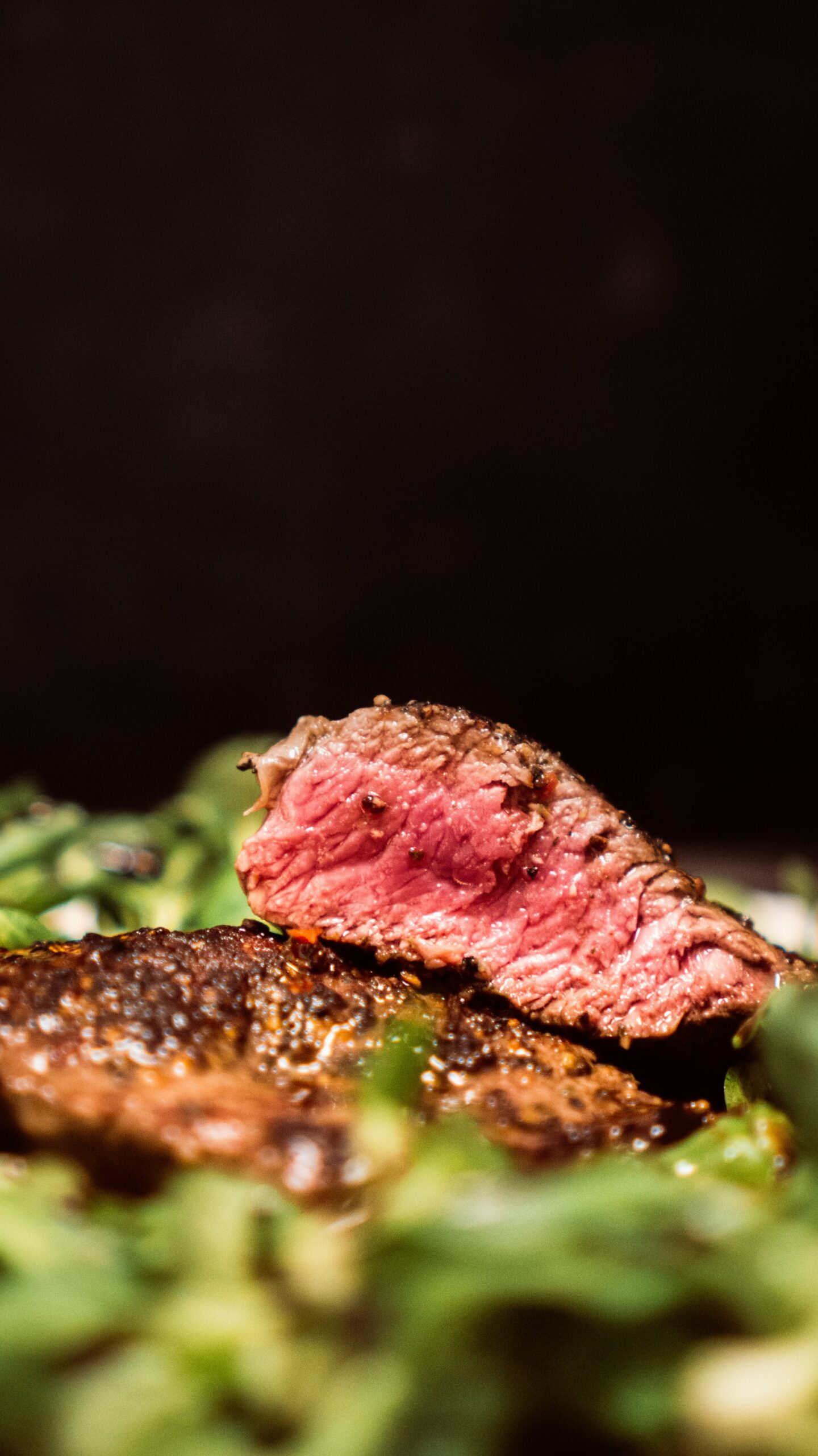 Close-up of a juicy medium-rare steak on a plate at a steak restaurant.