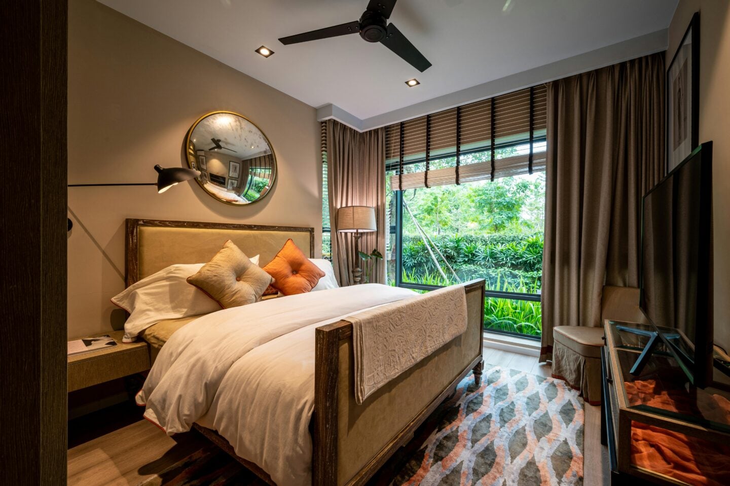 Modern bedroom on the lower floor with large windows and garden views, ideal for upside-down house layouts with bedrooms downstairs.