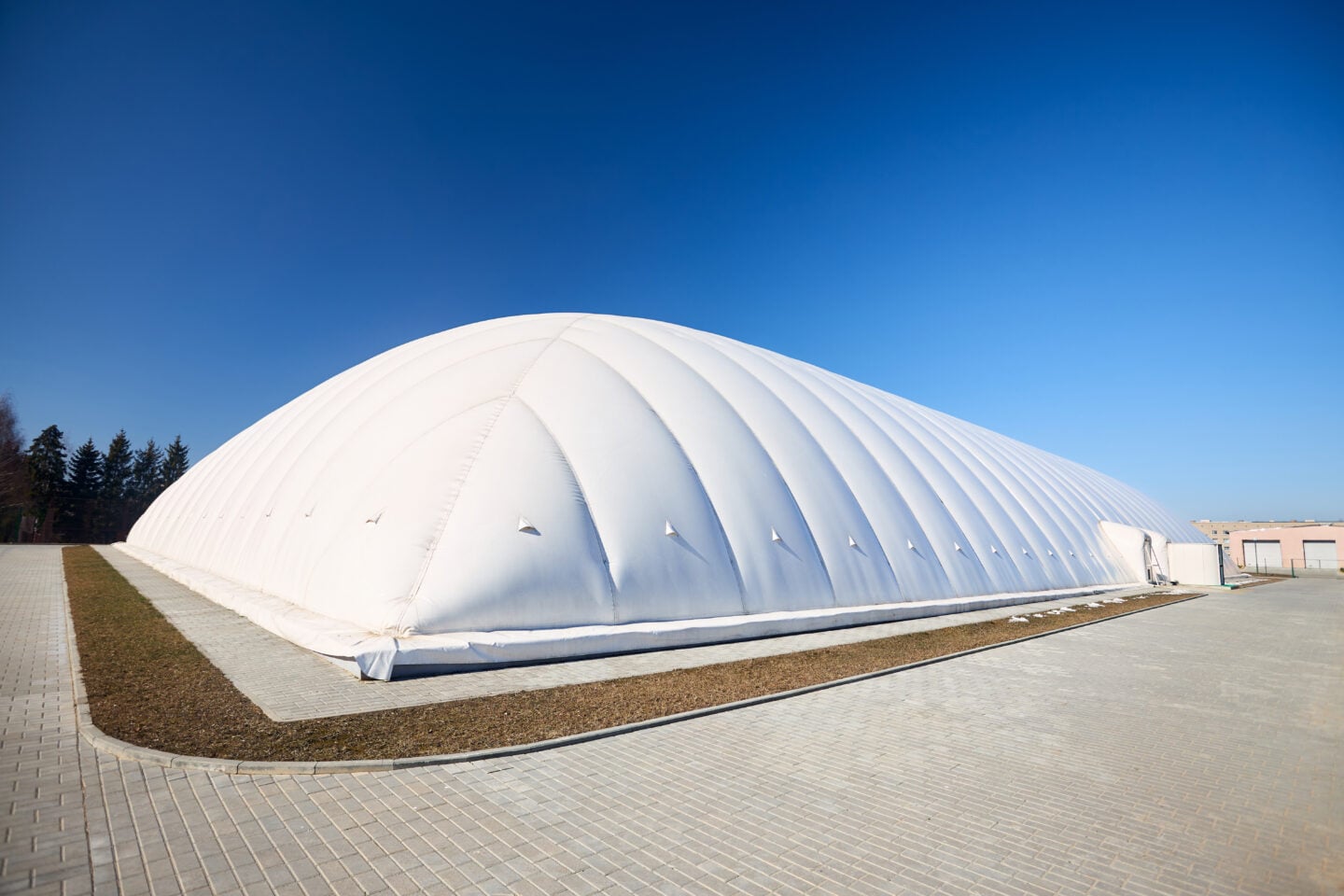 Inflatable air dome stadium. Inflated Tennis air dome or Tennis bubble arena. Modern urban architecture example, as pneumatic stadium dome.