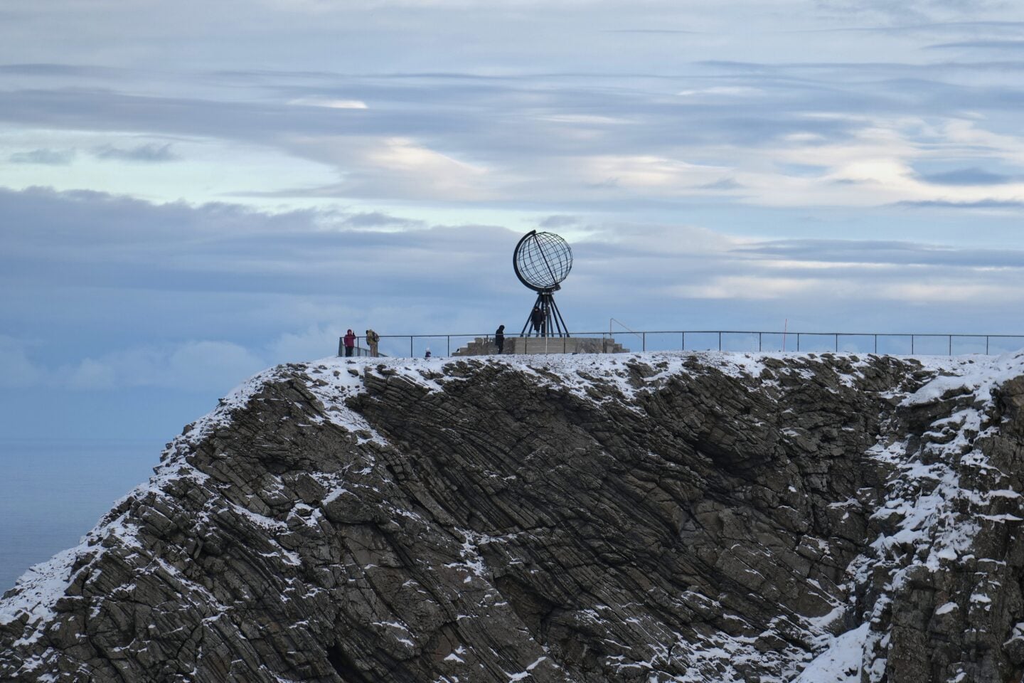North Cape monument on a snowy cliff overlooking the Arctic Ocean in Norway