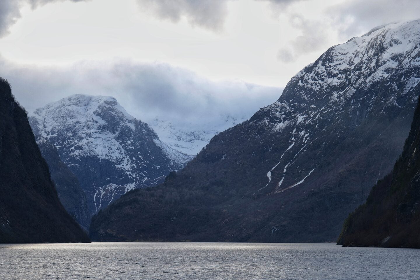 Steep mountains and calm waters of Nærøyfjord, a UNESCO World Heritage fjord in Norway