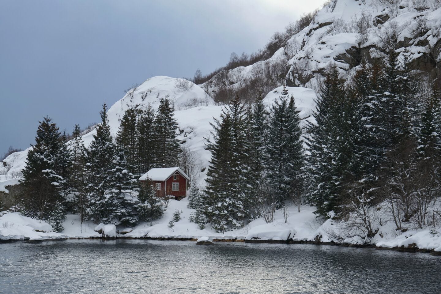 Wide fjord view of Raftsund with snowy peaks and calm water under winter light, Norway