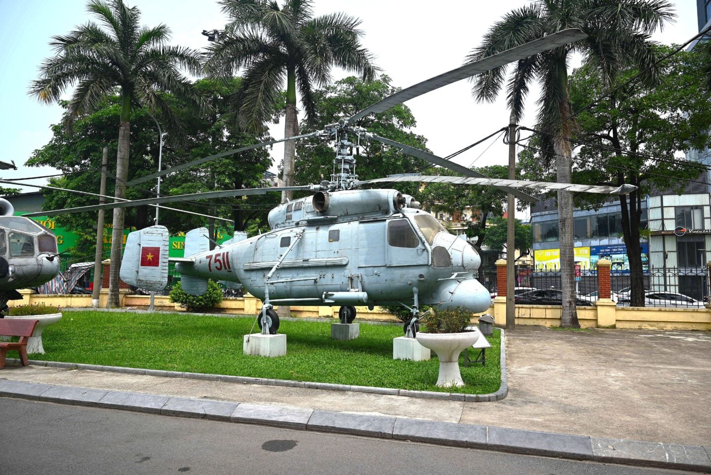 A helicopter (marked “751”) is displayed outdoors at the Vietnam Military History Museum, which showcases aircraft, tanks, and military equipment from Vietnam’s wars.