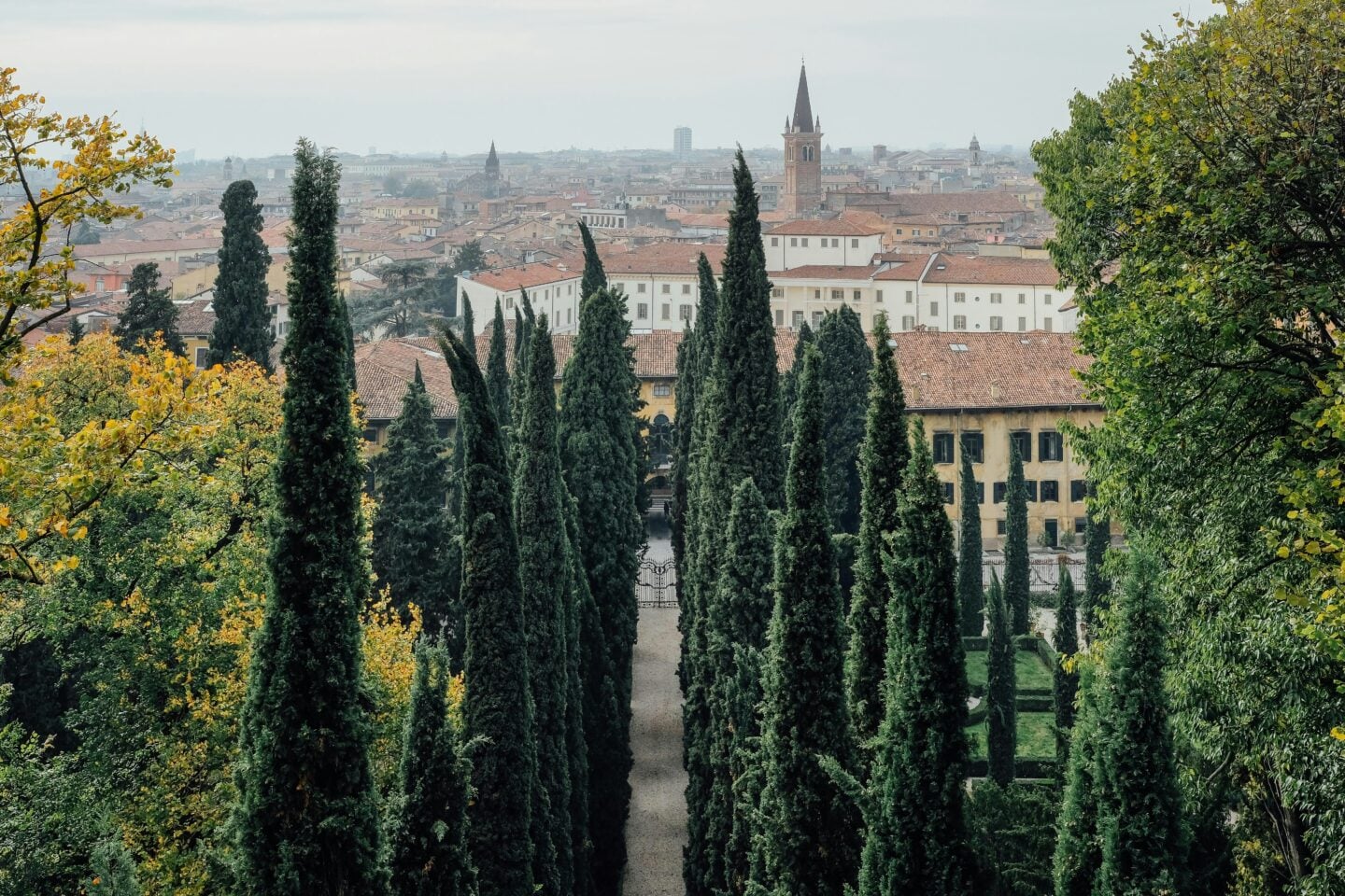 Cypress-lined garden paths overlooking the city at Giardino Giusti in Verona, Italy