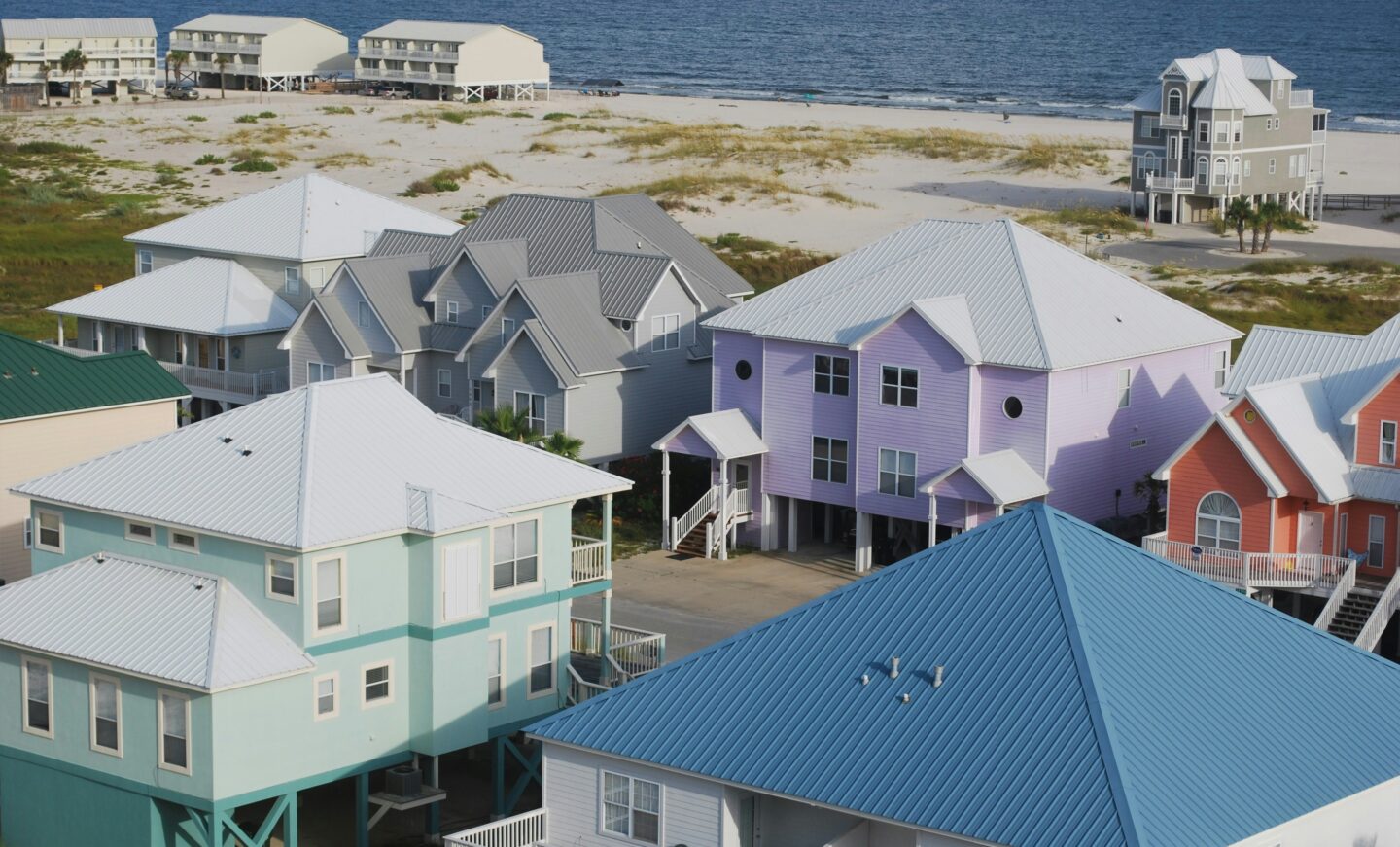 Colorful beach houses in Gulf Shores, Alabama, featuring pastel coastal homes near the shoreline of the Gulf of Mexico.