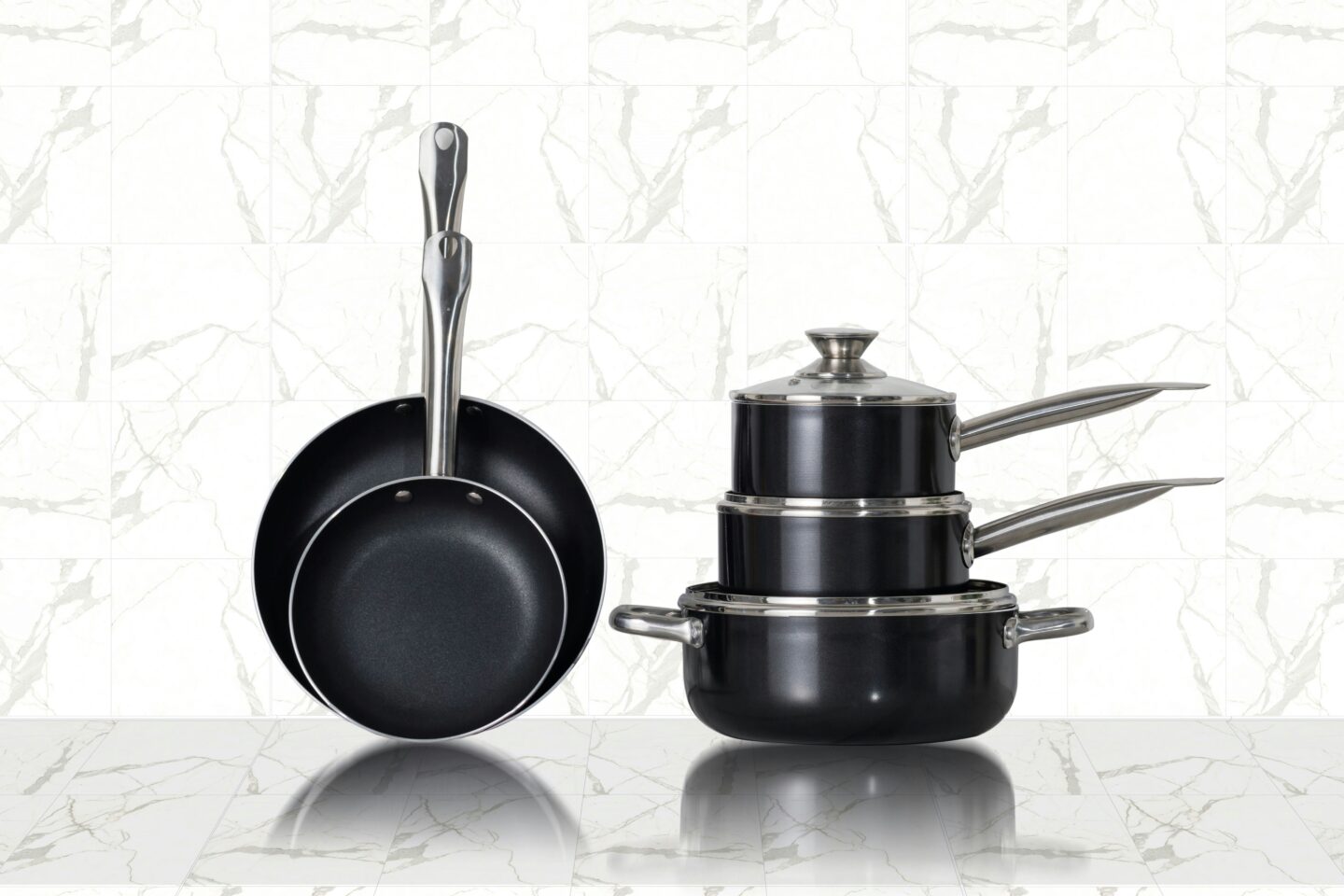 Modern nonstick cookware set displayed in kitchen, useful home essentials wedding gift for couples starting a new life together.