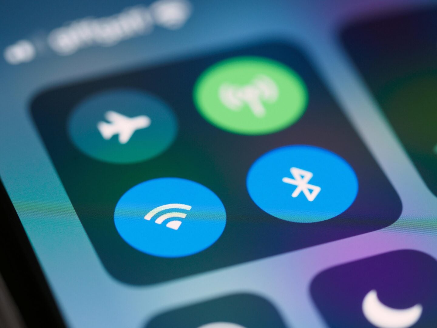 Close-up of smartphone control center showing airplane mode, cellular signal, WiFi, and Bluetooth icons.