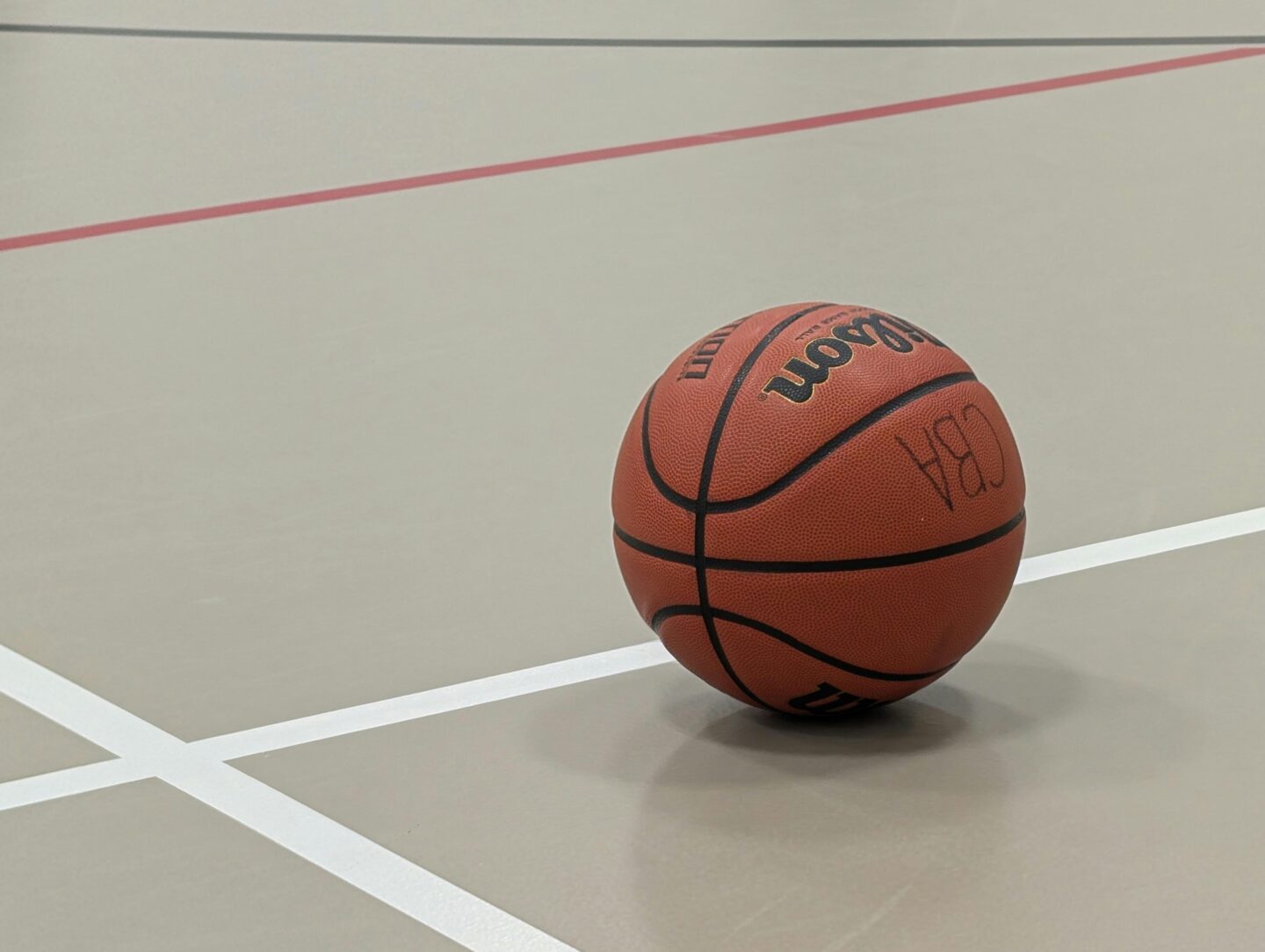 A basketball on a court.
