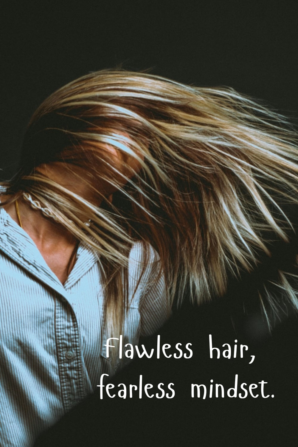 Close-up of woman flipping highlighted hair in motion against a dark background with the quote “flawless hair, fearless mindset.”