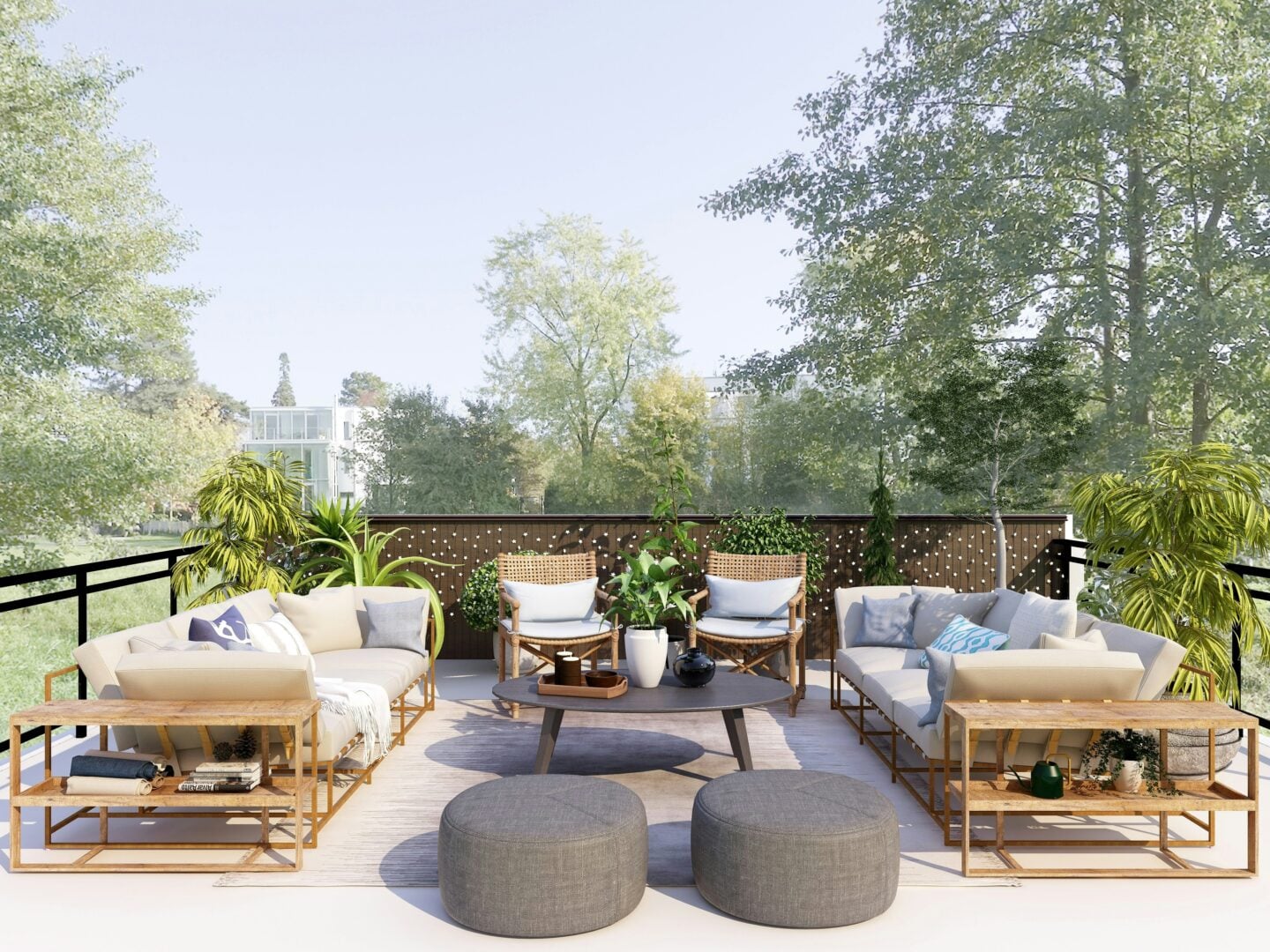 Modern outdoor living space with two cream-colored sofas, woven accent chairs, gray poufs, and a round coffee table arranged on a spacious terrace surrounded by lush greenery. Potted plants, decorative cushions, and warm natural materials create a comfortable, home-like atmosphere with peaceful garden views.