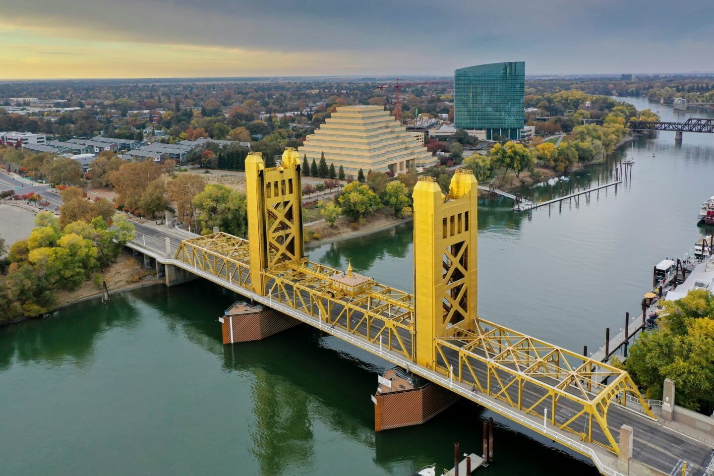 Aerial view of the Tower Bridge spanning the Sacramento River with downtown Sacramento, California, USA, in the background.