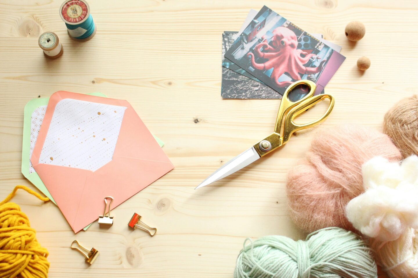 Scissors, yarn, paper, and craft supplies for creative DIY projects.