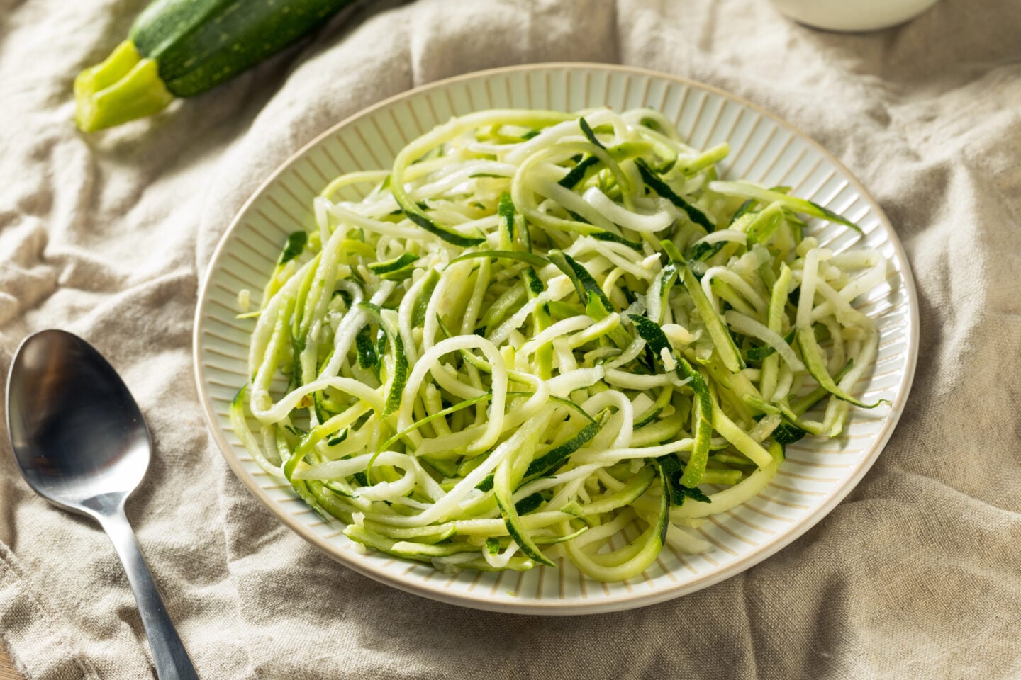 Zucchini noodles served on a plate.